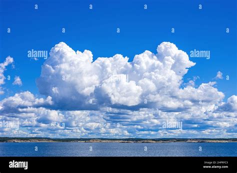 Skerries And Coastline Under A Bright Cloudy Blue Sky In The Koster