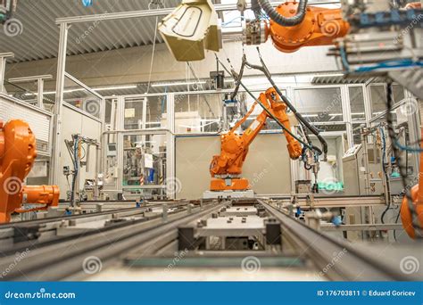 Robot Arms In The Factory Performs Precise Work According To The
