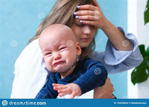 Mom Tired Trying To Calm Her Crying Baby Newborn Tantrum Child On