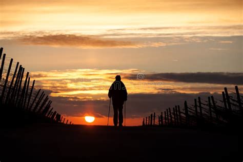 Man Walking Off Into Sunset Stock Photo Image Of Person Lone 17141770
