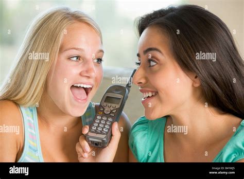 Teenage Girls Talking On Telephone Stock Photo Alamy