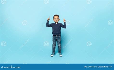 Look Up Adorable African American Kid Boy Pointing Fingers Upward At