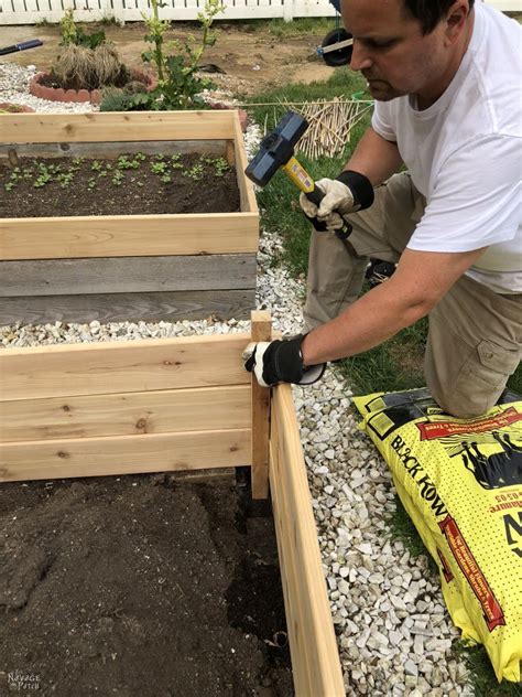 I raised it off the ground not only because i live on mostly rock but also so i won't have to kill my back or knees when tending to it. DIY Raised Garden Beds Tutorial | Raised garden beds diy ...