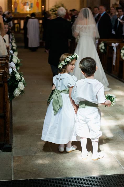Adorable Flower Girl And Page Boy Wearing Outfits Designed By