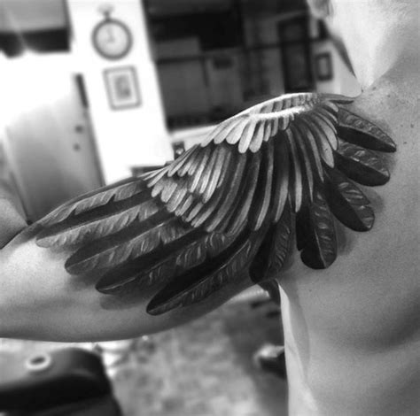 Grey ink shoulder wings tattoo. 32 Best Wing Tattoos For Men and Women - TattooBlend