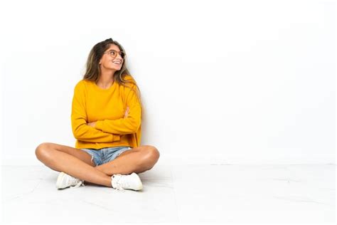 Premium Photo Young Woman Sitting On The Floor Isolated On White