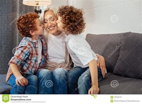 Adorable Brothers Kissing Their Loving Grandma Stock Image Image Of