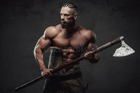 Brutal Viking Posing Holding Shield And An Axe In Studio Stock Image