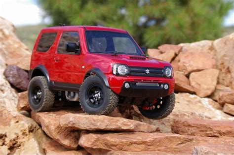 A Red Toy Truck Is On Some Rocks