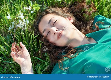 Beautiful Girl Lying On The Grass At Sunny Day Face Closeup Summer Forest Bright Landscape