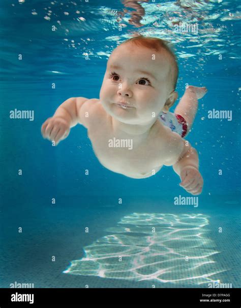 Baby Swimming Underwater In Swimming Pool Stock Photo Alamy