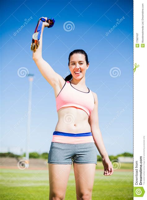 Happy Female Athlete Showing Her Gold Medals Stock Image Image Of Adult Holding