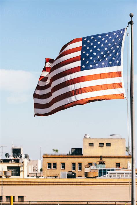 Closeup Of American Flags Flying Over Downtown Los Angeles Rooftops