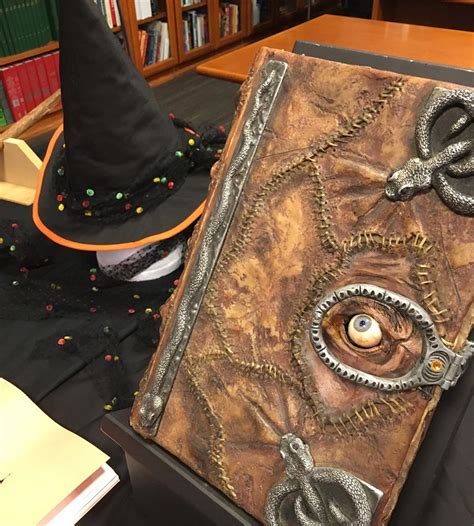 The Spell Book Of Winifred Sanderson Displayed Alongside Thora Birchs