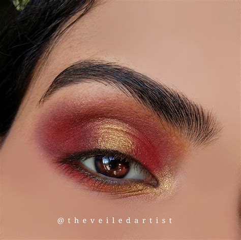 Red And Gold Halo Smokey Eyes With Dramatic Arabic Winged Liner