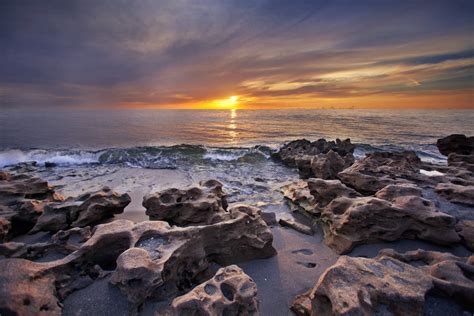 Solid Rocks Near Seashore During Sunset Hd Wallpaper Wallpaper Flare