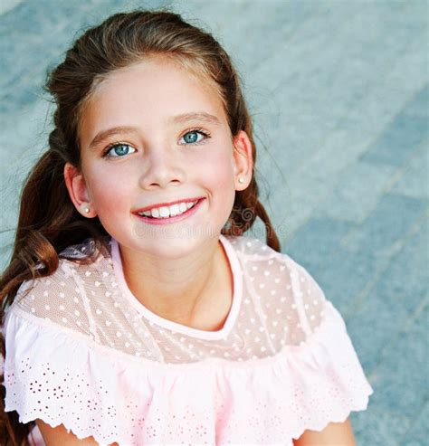 Portrait Of Adorable Smiling Little Girl Child On Summer Day Stock