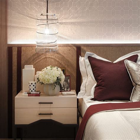 Dangle a cluster of copper orbs over your bedside table, adding elegance and a touch of the unique to the room you wake up in. An oversized pendant light hanging over a bedside table is ...