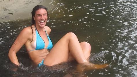 Bikini Clad Woman Swings Into Shallow Water Jukin Licensing My XXX