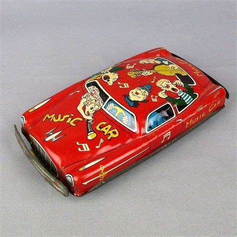 The postwar american occupation of japan gave japanese toymakers ready access to the lucrative american toy market, and as a result most of the tin toy cars made in this period were based on american vehicles like cadillacs, chevrolets, buicks, oldsmobiles and packards. Vintage 1950s Tin Litho Friction Toy Car MUSIC CAR from ...