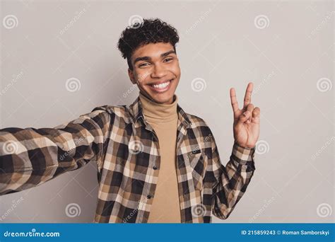 photo of guy take selfie show v sign toothy smile wear checkered shirt turtleneck isolated grey