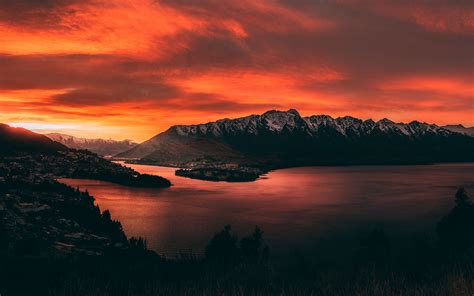 Body Of Water Near Mountains At Golden Hour Macbook Air Wallpaper