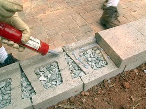 Trowel spreading mortar on footing. 15 DIY Retaining Walls To Add Value To Your Landscape ...