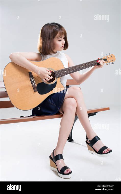Young Woman Playing Guitar Stock Photo Alamy