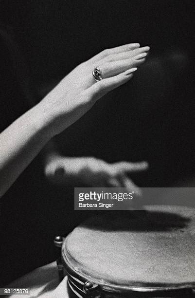 woman playing bongos photos and premium high res pictures getty images