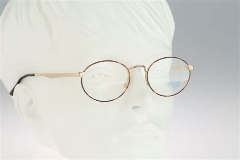 vintage oval eyeglasses action line 2021 300 90s unisex gold and tortoise oval optical frame