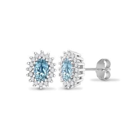 9ct White Gold 25pts Diamond And Blue Topaz Stud Earring