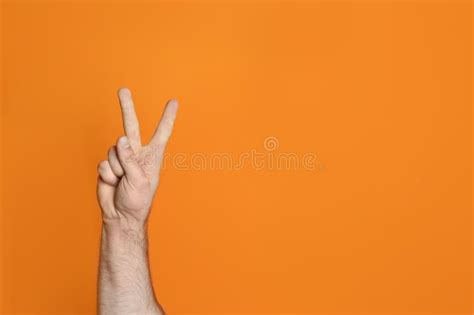 Young Man Showing Victory Gesture Stock Photo Image Of Athlete Body