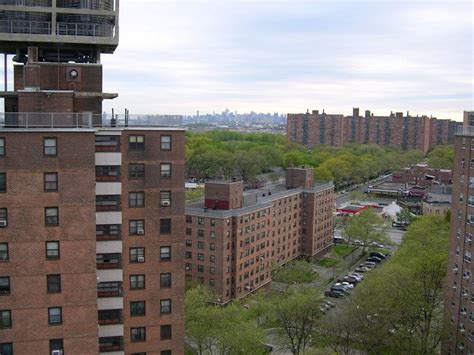 Apartment Buildings In Soundview With The Midtown Manhattan Skyline In
