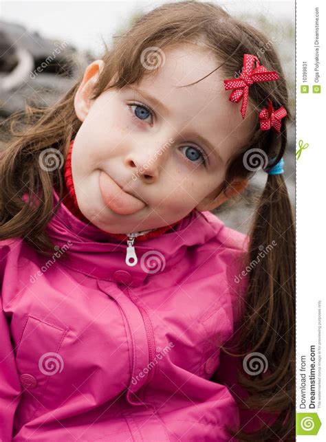 Girl Showing Her Tongue Stock Image - Image: 10399831