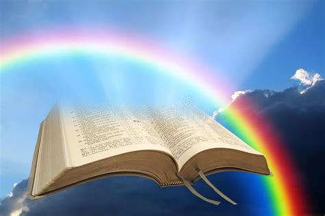 An Open Book With A Rainbow In The Background