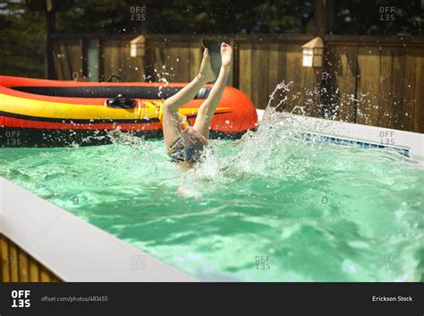 Child Diving Into A Swimming Pool Stock Photo Offset