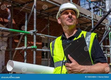Thoughtful Male Builder Architect Construction Worker On Building Site