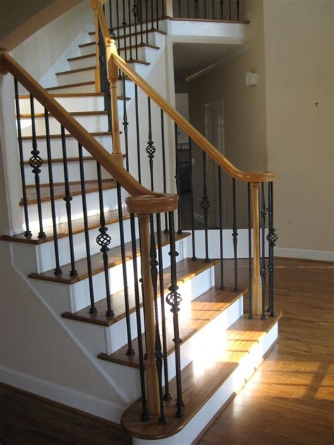 Wrought iron railing may be installed on treads, knee walls, or along flat surfaces, like balconies. New Hardwood staircase and wrought iron balusters ...