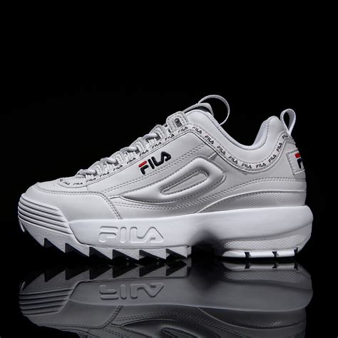 (d/b/a fila) is an italian sportswear manufacturer that designs shoes and apparel founded by ettore and giansevero fila in 1911 in biella, piedmont, italy. FILA Disruptor II TAPEY TAPE - White WWT - 1004 K-SHOP