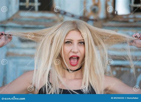 blond woman play with hairs with screaming face stock image image of lovely pull 89294335