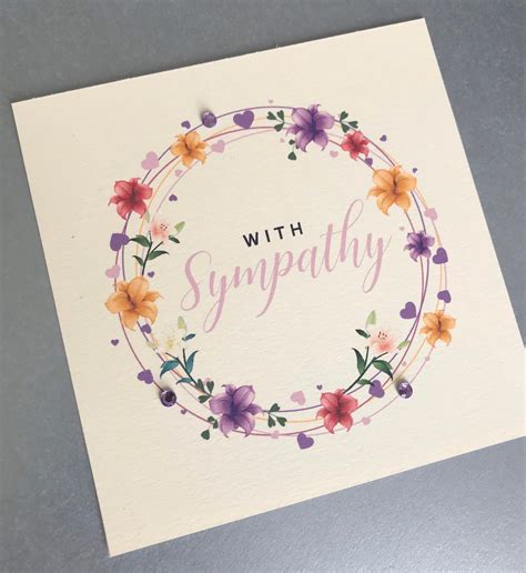 A Greeting Card With The Words Sympathy Written In Pink And Orange