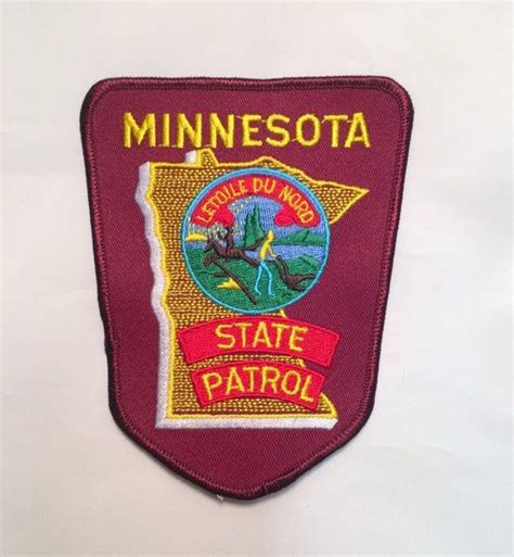 The Minnesota State Patrol Badge Is Shown On A White Background With