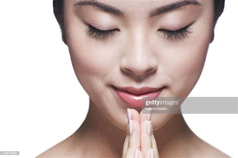 Beauty Shot Of Asian Woman With Eyes Closed Photo Getty Images