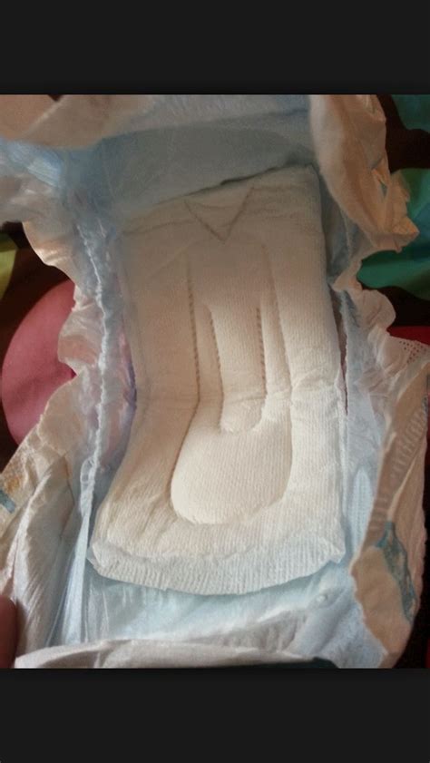 Maxi Pad In Baby Diaper Neonbodyartcanvas