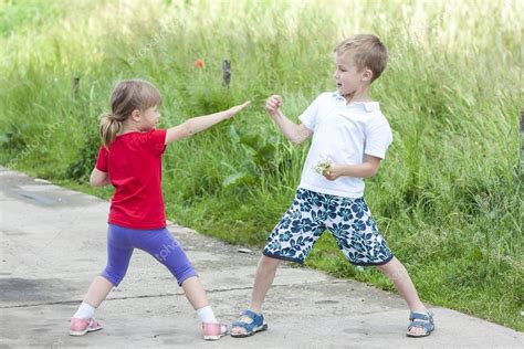 Children Playing Fighting On Sunny Summer Day — Stock Photo © Bilanoli