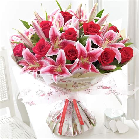 You may choose to simply send a bear with roses to your beloved too if you prefer. Stunning rose and lily bouquet | Flower with Vase ...