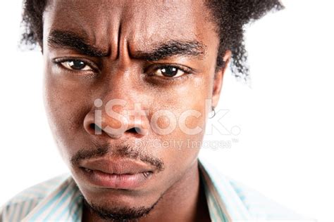 Unhappy Frowning Young Man Looks Cross And Sulky Stock Photo Royalty