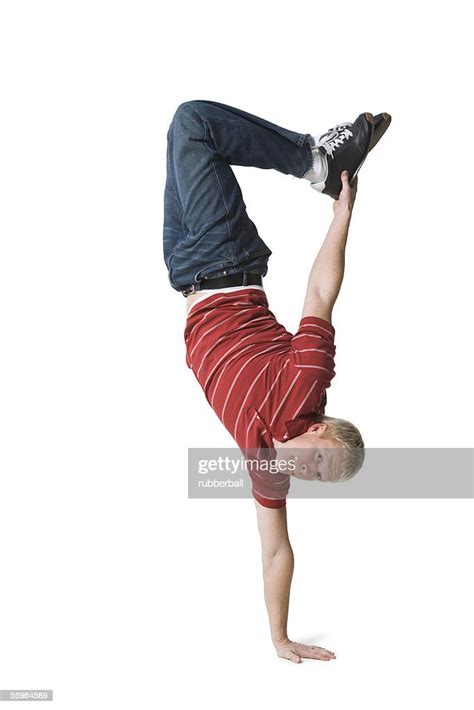 Portrait Of A Young Man Doing One Handed Handstand High Res Stock Photo