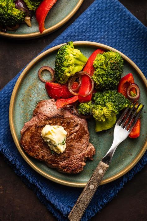 Grilled Beef Steak With Garlic Butter And Vegetables Meat With Stock