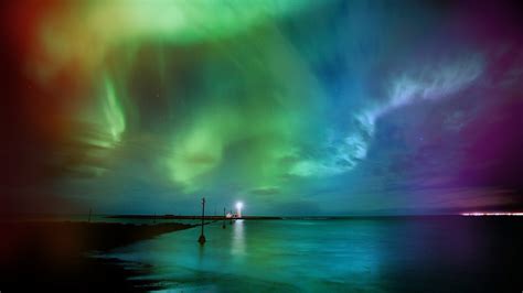 Rainbow Aurora Borealis Over The Sea